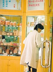 Sex shop assistant in a lab coat